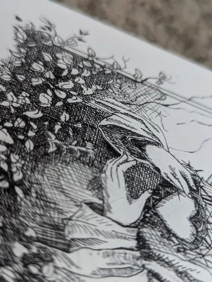 An angled detail shot of the ink drawing, highlighting the depth created by the dense cross hatching technique in the shadows.