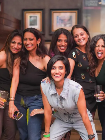 A group of ladies having a fantastic time at Hardrock Cafe.