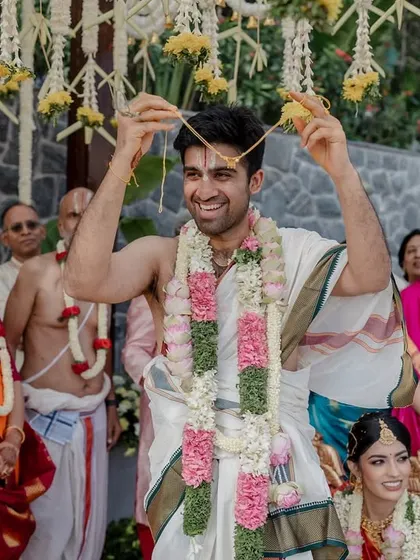 The groom's happiness is palpable during this key moment of the wedding ceremony. We capture the joy and significance of each ritual.