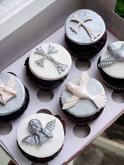One of my favorite cupcake sets. These were for a baptism, featuring delicate, hand-molded fondant toppers of crosses, angels, and doves.