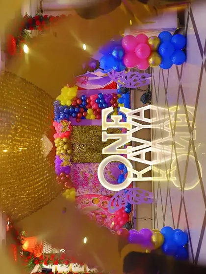 A creative, artistic shot of Kavya's butterfly-themed first birthday stage.