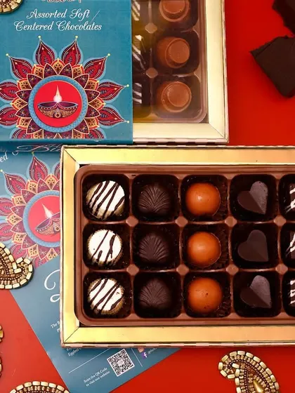 We offer larger boxes of 18 assorted soft-centered chocolates for those grand gestures. The festive packaging makes it a standout gift for Diwali or other celebrations.