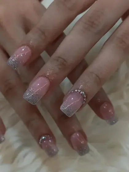 Another view of the delicate pink and silver glitter gradient nails.