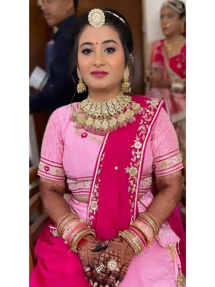 This bride is glowing in her beautiful pink and magenta outfit. I used a complementary pink-toned makeup look with a bold lip to match the traditional yet vibrant feel of her attire.