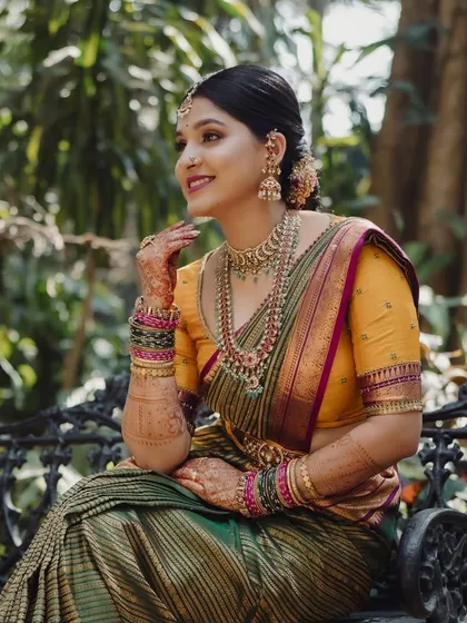 A beautiful, candid shot of the bride, her smile lighting up her face as she sits on a bench.