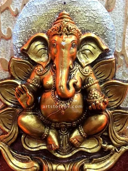A detailed view of the Ganesha sculpture from the commercial nameplate. The antique gold finish and intricate details on the idol demonstrate the high level of artistry we bring to every project, whether residential or commercial.