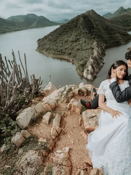 A tender embrace overlooking the stunning lakes and hills of Udaipur. We focus on capturing these gentle, unposed interactions that reveal the true connection between a couple, set against an epic natural backdrop.