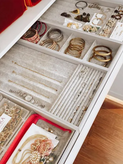 An organized jewelry drawer makes getting ready a pleasure. We use a combination of sectioned trays for bangles, velvet-lined inserts for rings, and clear pouches for sets.