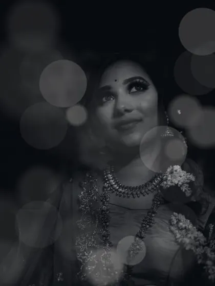 A moody and atmospheric black and white portrait. By combining a soft focus on the subject with a creative bokeh overlay, we created an image that feels dreamy, introspective, and full of emotion.