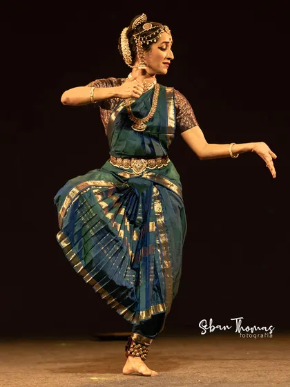 Another moment from the recital, showcasing the traditional pleated costume that fans out beautifully with movement.