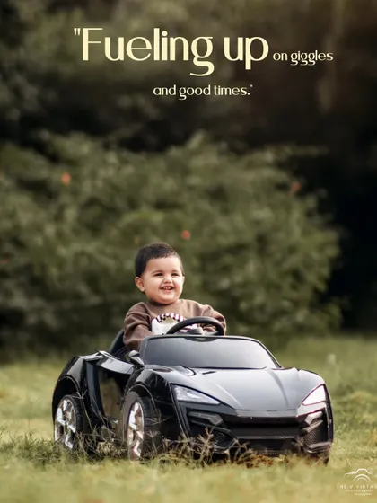 Fueling up on giggles and good times. This happy boy is having a blast driving his toy car through the grass.