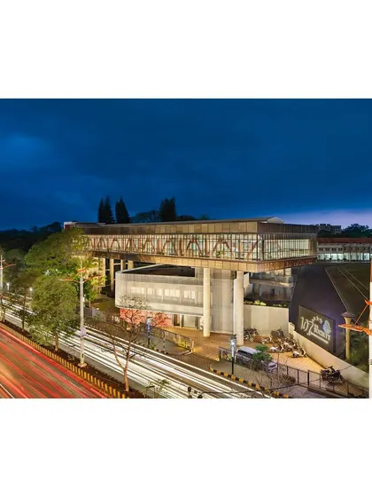 "Hoverspace" is our solution for expanding a corporate office without disturbing the existing 50-year-old structure. The new steel-truss volume floats above the old, creating a dialogue between past and present while giving the organization a new landmark presence.