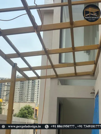 A perspective shot showing the carport framework against the city skyline. Even in the early stages, the precision of the fabrication is clear. We build structures that are not only functional but also architecturally sound and built to last for decades.