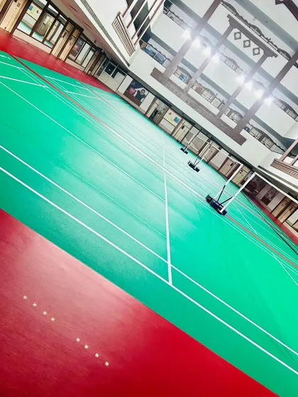 The view from the baseline of our pristine courts. The clear markings and high-quality surface are essential for drills that focus on footwork and precise shot placement.