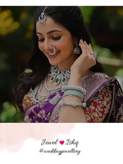 A beautiful smile from a happy bride. For this modern Marathi wedding look, we chose an all-diamond set with emerald accents to pair with her traditional Nauvari saree, creating a fresh and elegant style.