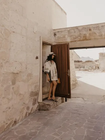The bride-to-be, Sankriti, exploring the ancient stone pathways of Cappadocia. These solo portraits are a beautiful part of the pre-wedding narrative.