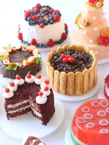 A beautiful collection of various miniature cakes, showing the range of styles and decorations taught in the course.
