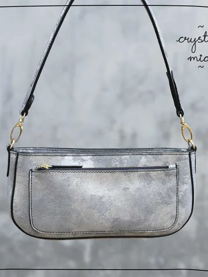The Mia baguette in our Crystal leather. This was a very special foiled leather with a distressed, metallic silver finish. It was soft and easy to work with, but like many of our upcycled leathers, it was a limited lot and is now sold out.