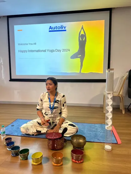 Preparing to play one of the chakra bowls during the Autoliv session. Each bowl corresponds to a different energy center in the body, helping to create balance.