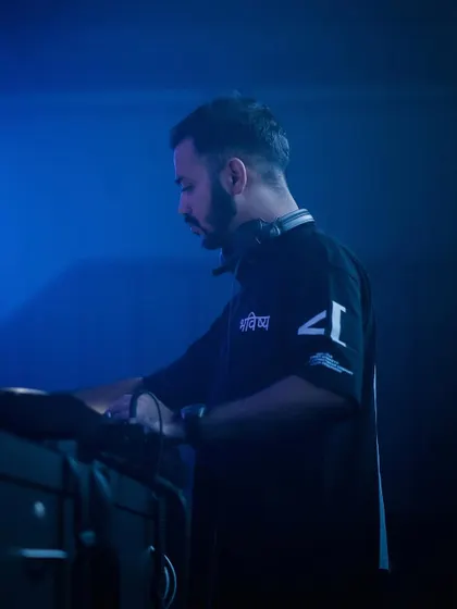 A moody, blue-lit shot of me deep in concentration during a set.