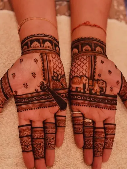 A simple yet elegant design for the back of the hands, featuring elephant and peacock motifs.