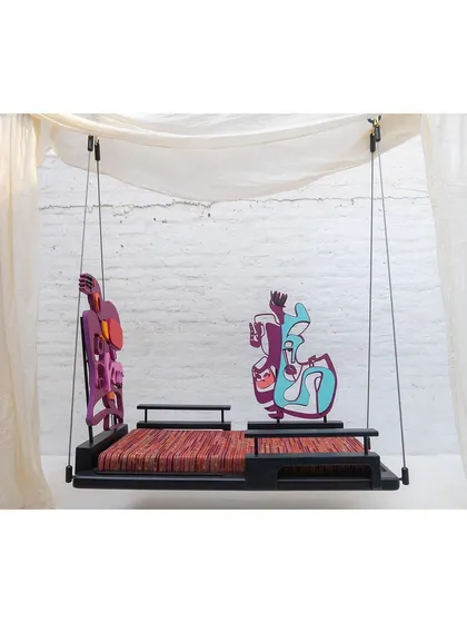 The 'Kaleidochaos' swing with the backrests arranged in a different configuration, facing outward.