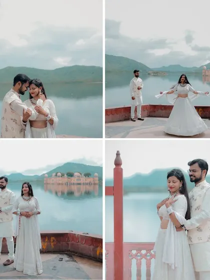 A serene pre-wedding shoot at Jal Mahal, with the couple dressed in matching white outfits that complement the tranquil lake and cloudy sky.