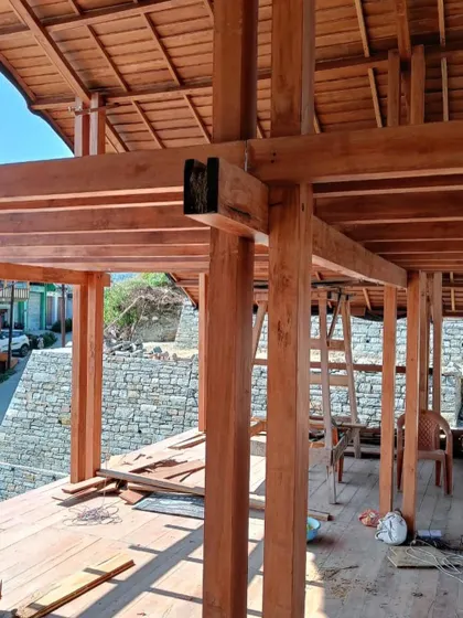 **Market Plaza, Champawat:** A close-up of the wooden joinery. We believe in the beauty of well-crafted details and the honest expression of structural elements.