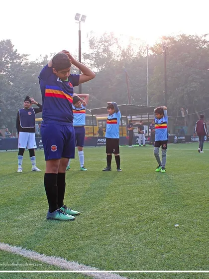 Stretching is fundamental to our training routine. Here, our players are performing guided stretches to improve flexibility and aid in muscle recovery after an intense session.