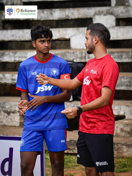 A one-on-one discussion between a coach and a young team captain. We focus on developing leadership skills and game intelligence, ensuring our players are prepared for every situation.