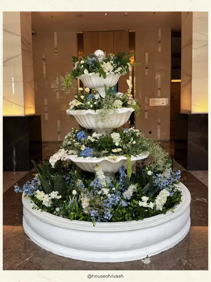 This collection of images provides a deeper look into my blue and white themed events. You will find details like custom stationery, floral-filled fountains, elegant table settings with blue pottery, and beautifully styled lounge areas, all showcasing a timeless and sophisticated design approach.