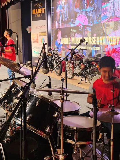 A view from behind the drum kit during a live band performance at Madfit 2023.