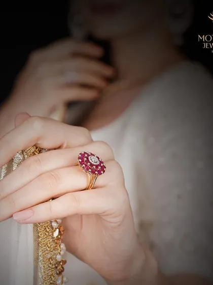 A clearer view of the classic ruby and diamond floral cluster ring. The rich red of the rubies is perfectly complemented by the sparkle of the surrounding diamonds.