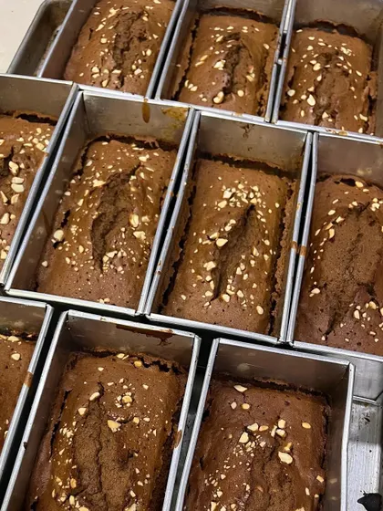 Our Christmas plum cakes, fresh from the oven and ready to be packed. The aroma fills the entire bakery.