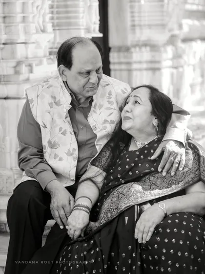 A classic black and white close-up of the anniversary couple, highlighting their enduring affection. This timeless style is perfect for milestone celebrations.