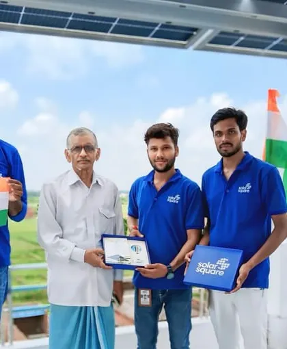 Our installation crew celebrating a successful project completion with a homeowner and his family, holding the Indian flag. Each installation is a partnership in building an Atmanirbhar Bharat.