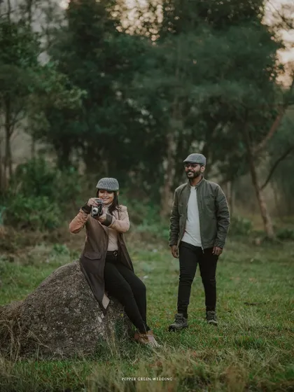 The bride-to-be captures a memory with a vintage camera, adding a unique storytelling layer to their classic, rustic pre-wedding session.