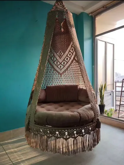 Our single seater swing placed on a balcony with a city view. It’s a perfect way to create a small, personal oasis even in an urban apartment.