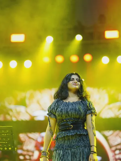 A candid shot under the yellow stage lights. Each show has its own unique mood and color.