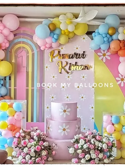 This daisy themed party for Prnavi Rihan was a pastel paradise. The setup featured a beautiful arch of colorful balloons, smiling daisy props, and flower bouquets, creating a fresh and joyful atmosphere.