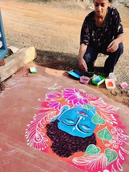 My rangoli art for a special occasion, featuring a portrait of Krishna. I love using the ground as my canvas to create temporary, beautiful art.