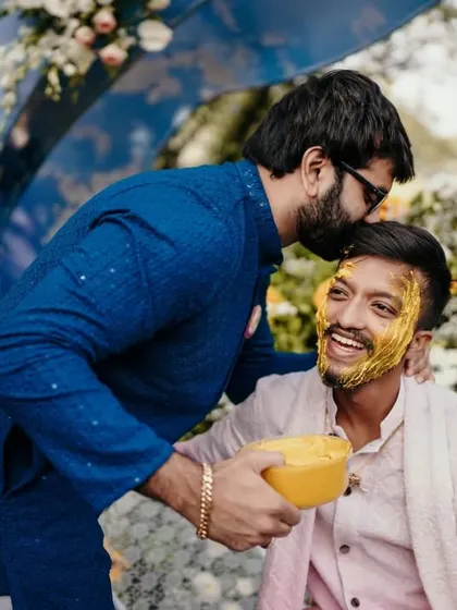 A heartwarming moment between the groom and a friend during the Haldi ceremony.