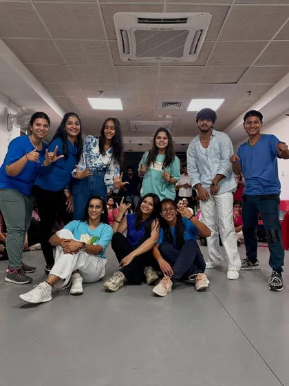 The 'Water' crew posing together after their smooth performance. All smiles and good vibes.