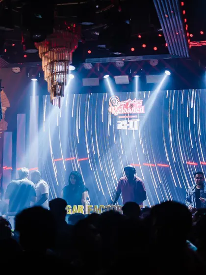 A dramatic shot of the stage and lighting setup at Sugar Factory.