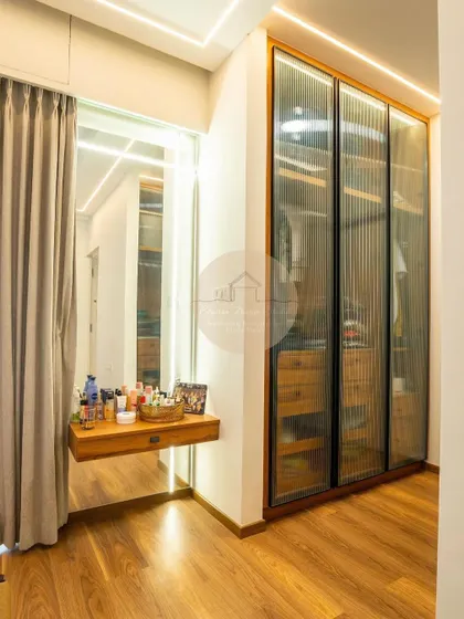 A collection of our custom wardrobe designs, showcasing different finishes like glass, laminate, and wood, as well as various internal configurations to meet the specific storage needs of our clients.