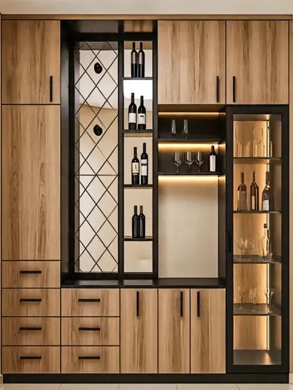 This floor-to-ceiling cabinet is a complete storage solution. It combines a crockery unit with glass doors, a built-in bar section with a mirrored back, and a diamond-patterned wine rack for a highly functional design.