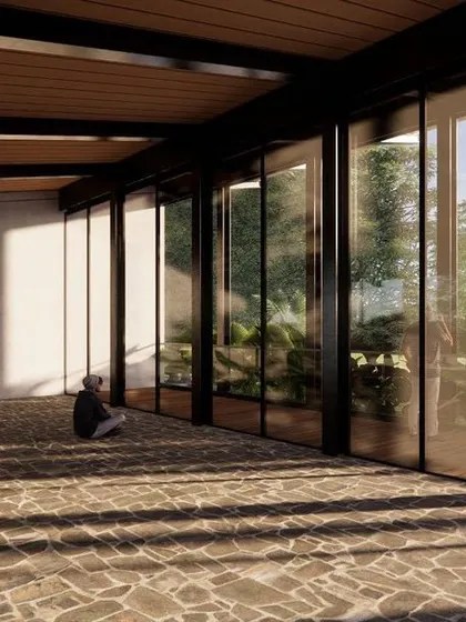 The interior of the multipurpose hall is envisioned as a flexible, open space with natural stone flooring. Sunlight filtering through the trees creates beautiful shadow patterns on the floor.