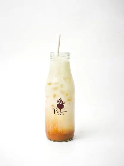 A bottled iced coffee, shot cleanly against a white background for a minimalist product-focused image.