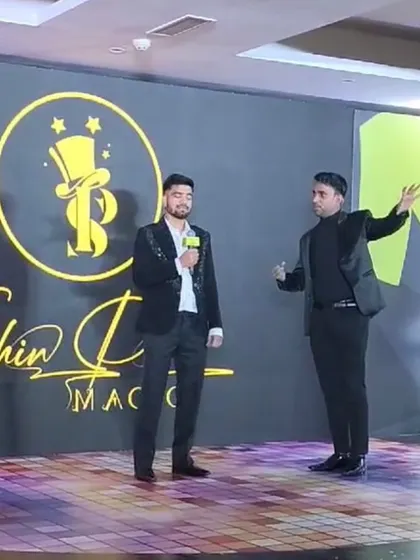 Performing a mentalism routine with a guest on stage at the inDrive event. The audience's focus is entirely on the mystery.