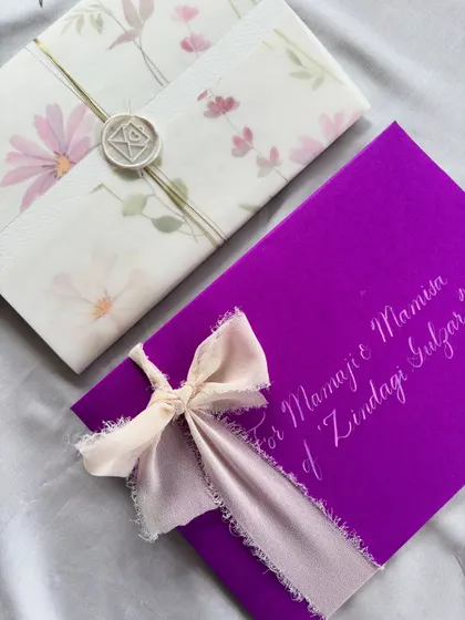 Words of nostalgia and warmth. Handwritten letters are carriers of deeply special messages. This one, with its vibrant purple envelope and silk ribbon, was curated with intention to remind the reader how important they are.
